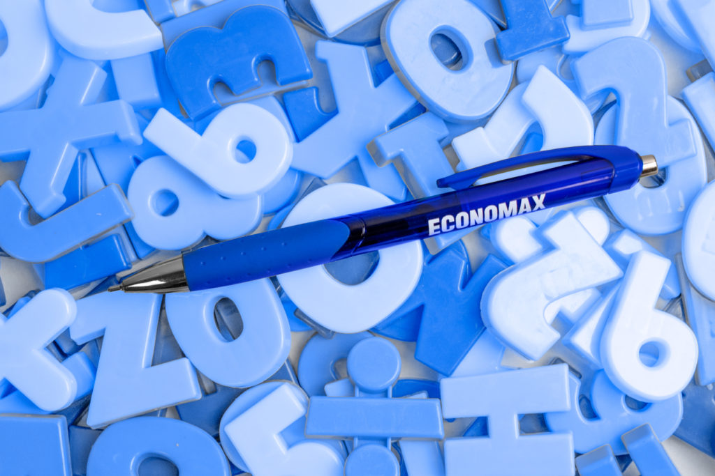 Zia blue promotional pen on top of alphabet and letter